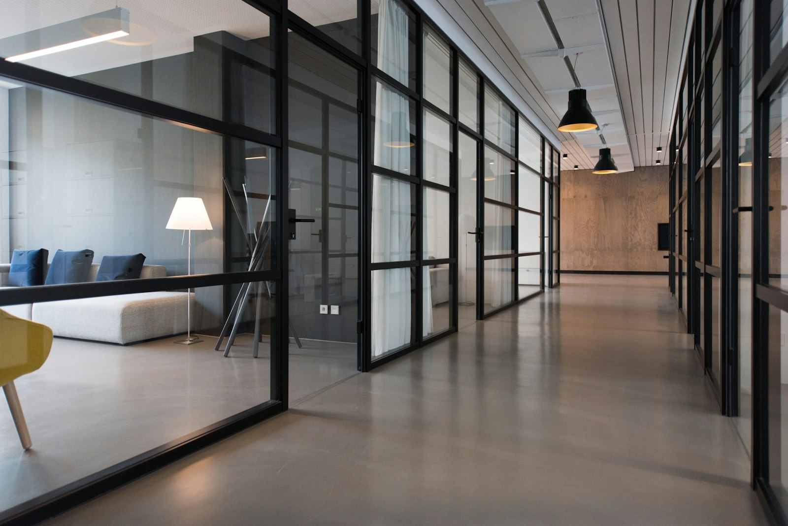 A hallway between glass-panel doors inside a law office